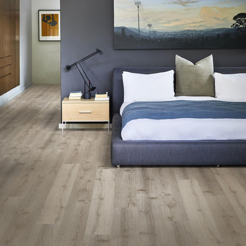 The Kährs Click 6mm Impression in Dovecot, showing off it's deep beige tones in a modern bedroom with a minimalist and modern touch.