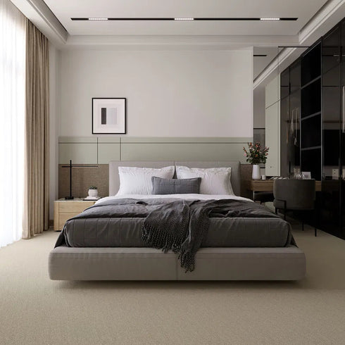 ITC Lima carpet in beige, adding a sleek and durable touch to a master bedroom with a modern and minimalist design.