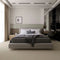 ITC Lima carpet in beige, adding a sleek and durable touch to a master bedroom with a modern and minimalist design.