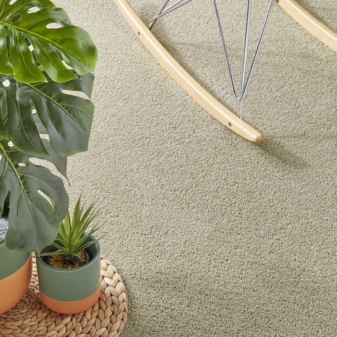Lano Boheme carpet in a very light olive shade, complementing a natural-themed room with earthy tones and soft, organic textures.