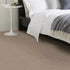 Alternative Flooring's Wool Iconic Herringbone in Pacino, set in a modern bedroom, with closeup of the herringbone's details running along the carpet.
