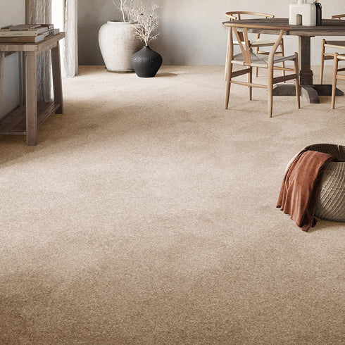Elegant GAIA® Dorado carpet in a soft beige tone, creating a warm and inviting ambiance in a sophisticated living room setting.