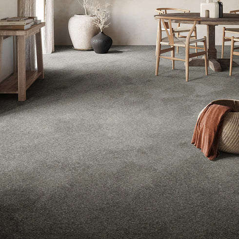 Luxurious GAIA® Dorado carpet in a sophisticated grey tone, enhancing a modern living room with its soft texture and timeless elegance.