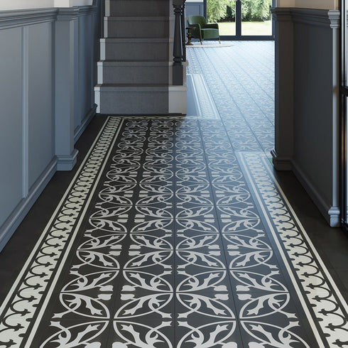 A contemporary commercial lounge space showcasing Invictus LVT Victorian Treasure Charcoal flooring, with its bold contrast and ornate vintage design enhancing the ambiance.