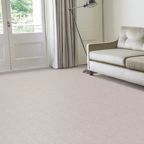Alternative Flooring's Wool Iconic Herringbone in Brando, set in a modern minimal living room with a blend of elegance and timelessness.
