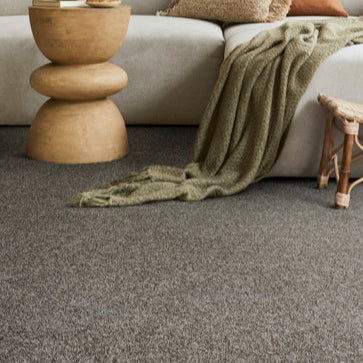 Lano Felicity carpet in Leather (grey), beautifully fitted in a cozy living room, enhancing the warm and inviting atmosphere with its soft texture and elegant design.