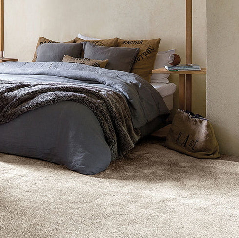 Soft and durable GAIA® Indus 30 carpet in a neutral light beige shade, crafted from 100% recycled polyester for eco-friendly luxury and resilience.