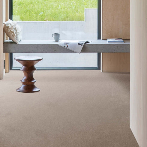 Soft and sustainable GAIA® Indus 36 carpet in a warm, neutral beige shade, crafted from 100% recycled polyester for durability, comfort, and eco-friendly living.