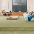 Sedna® Kai carpet in a deep olive green, creating a cozy and inviting atmosphere in the living space.