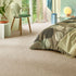 Sedna® Kai carpet in a soft beige, giving a natural and earthy tone to a stylish bedroom.