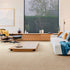 Sedna® Kai carpet in a light beige, grounding the aesthetic of a contemporary living room.