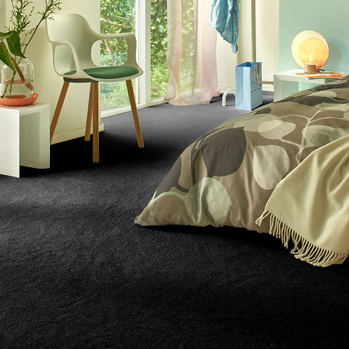 Sedna® Kai carpet in a rich charcoal grey, offering a bold and sophisticated look with a deep, near-black tone.