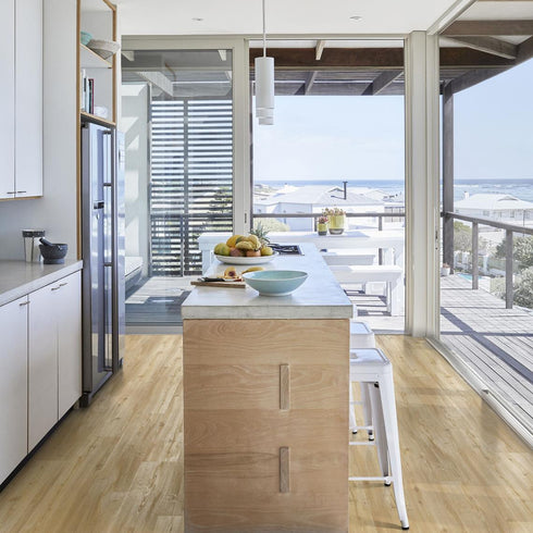 Kährs Oulanka luxury vinyl flooring presenting a warm, honey-toned oak appearance with delicate knots and grains, perfect for creating a cozy atmosphere.