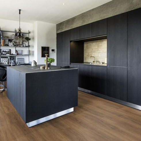 Kährs Redwood luxury vinyl flooring displaying a reddish-brown hue with intricate wood grain patterns, offering a bold and rustic charm.