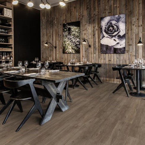 Kährs Sarek luxury vinyl flooring featuring a medium brown oak finish with balanced grain textures, suitable for versatile interior designs.