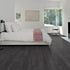 Kährs Schwarzwald luxury vinyl flooring showcasing a deep charcoal tone with subtle wood grain accents, adding a touch of modern sophistication.