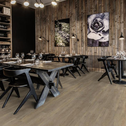 Kährs Taiga luxury vinyl flooring featuring a light oak finish with subtle grain patterns, providing a bright and natural look suitable for modern interiors.
