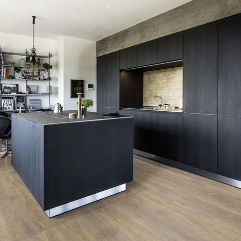 Kährs Taiga luxury vinyl flooring featuring a light oak finish with subtle grain patterns, providing a bright and natural look suitable for modern interiors.