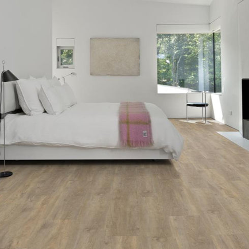 Kährs Taiga luxury vinyl flooring featuring a light oak finish with subtle grain patterns, providing a bright and natural look suitable for modern interiors.