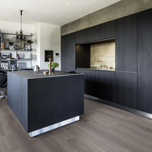 Kährs Wentwood luxury vinyl flooring featuring a soft beige oak appearance with subtle grain variations, enhancing airy and light-filled interiors.