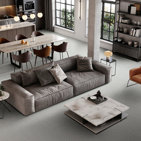 Lano Loft Life Pure carpet in a soft neutral tone, adding warmth and elegance to a spacious open-plan living and dining area with modern furnishings.