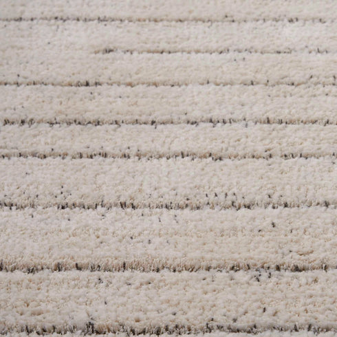 Detailed texture view of Nourison Andes Ridge Carpet in Ivory, emphasizing its soft fibers and subtle linear pattern.