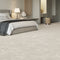 Luxurious light beige iSENSE® Obsession carpet in a serene bedroom setting, adding warmth and elegance.