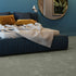 Luxurious light olive iSENSE® Obsession carpet in a stylish bedroom setting, bringing a natural and calming ambiance.