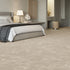Warm beige iSENSE® Obsession carpet in a bedroom, creating a cosy and inviting atmosphere.