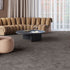 Mid-tone grey iSENSE® Obsession carpet in a living room, offering a balanced cement-like shade for a modern and sophisticated ambiance.
