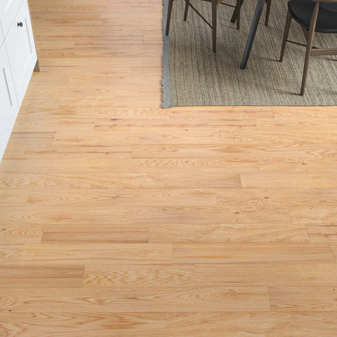 A close-up of LuxeFloors Co. Richmond Engineered Oak flooring in a contemporary kitchen space. The durable and versatile engineered oak planks seamlessly blend into the decor, offering warmth and sophistication with a smooth, protective UV lacquered finish.