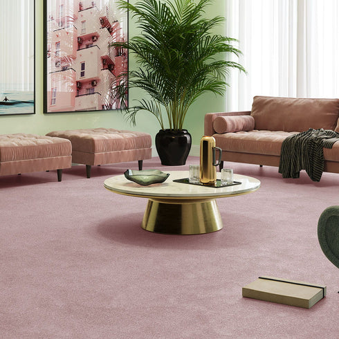 iSENSE® Subtlety carpet in a soft pink shade, complementing a vintage living room with elegant gold detailing on the furniture, adding warmth and sophistication.