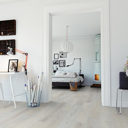 Strata Metro 30 light oak flooring in a bright, modern home office leading to a stylish bedroom, blending Scandinavian-inspired design elements.