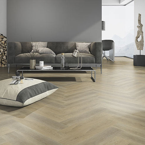 Strata Metro 30 LVT flooring in a modern living room with herringbone design, showcasing a sophisticated and stylish aesthetic.