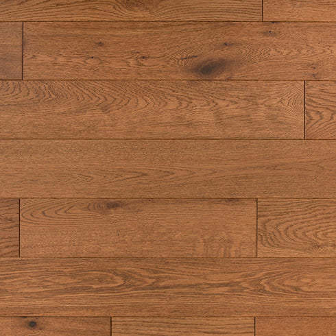 Close-up view of Wimbledon Engineered Oak flooring by LuxeFloors Co., showcasing its rich golden-brown tones and natural wood grain texture.