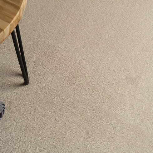 A detailed close-up of ITC Cabernet carpet showcasing its luxurious wool texture in a warm beige tone, offering supreme softness and durability for a timeless and elegant flooring solution.