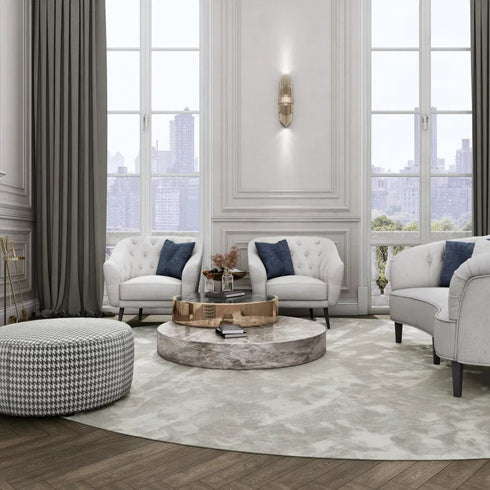 A sophisticated living room featuring ITC Cabernet, a premium wool carpet in a soft neutral tone, perfectly complementing the elegant white and gold decor with plush seating and grand windows.
