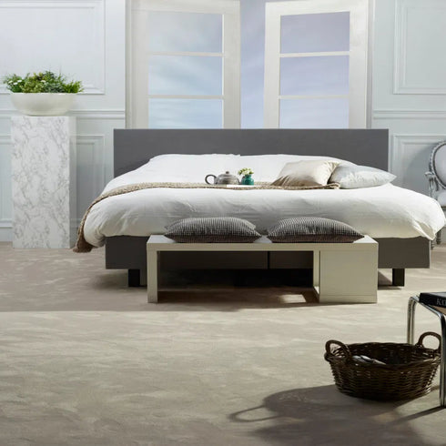 ITC Chablis carpet in a warm light beige tone, elegantly laid in a stylish bedroom, creating a cosy and sophisticated ambiance.