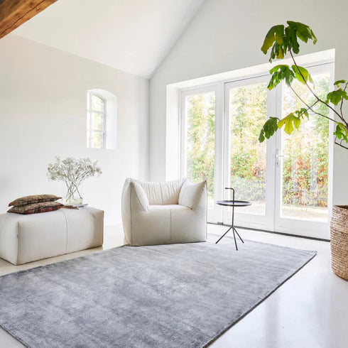 Grey ITC Galaxy rug in a simple, modern conservatory, enhancing the space with elegance and contemporary charm.