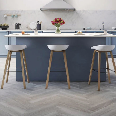 Amtico Click Smart Parquet in Nordic Oak – Close-Up View – A close-up of Amtico Click Smart Parquet flooring in Nordic Oak, showcasing the detailed wood grain and herringbone pattern.